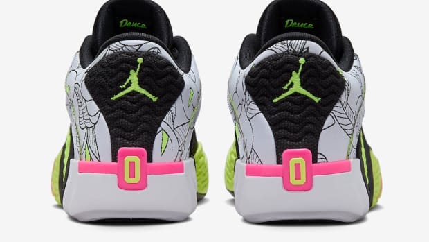 Rear view of Jayson Tatum's white, black, and green Jordan Brand sneakers.